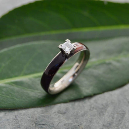 Princess cut diamond wood engagement ring with koa wood and white gold close up of grain