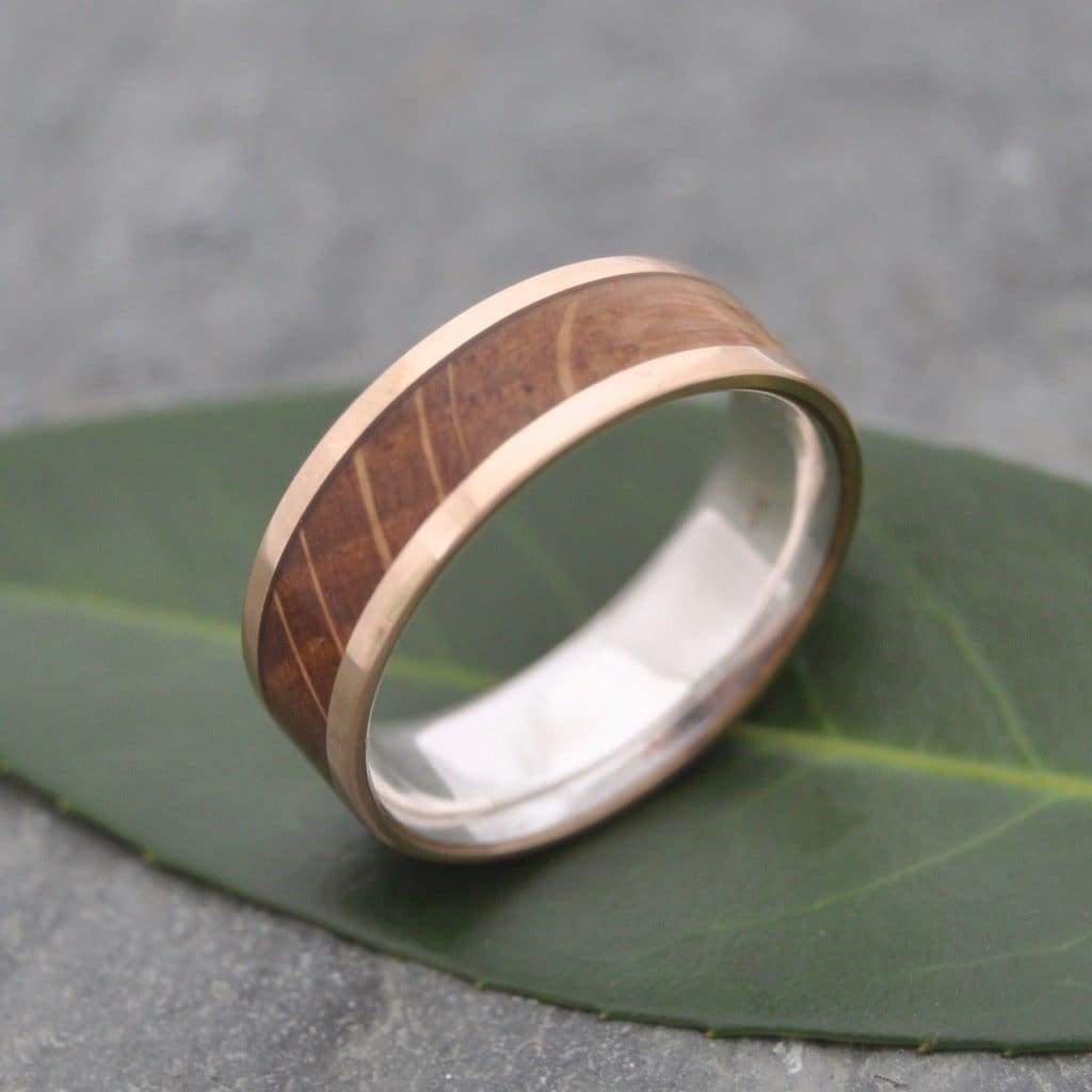 Reclaimed bourbon barrel wood ring with yellow gold exterior and silver interior