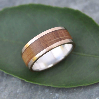 Sustainable bourbon barrel ring with yellow gold edges and sterling silver comfort fit band