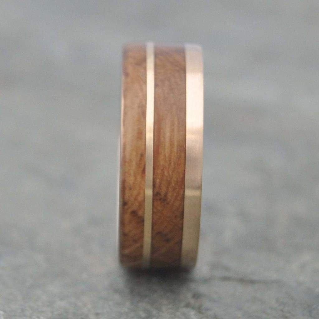 Handcrafted mens ring with bourbon barrel wood and recycled 14k yellow gold