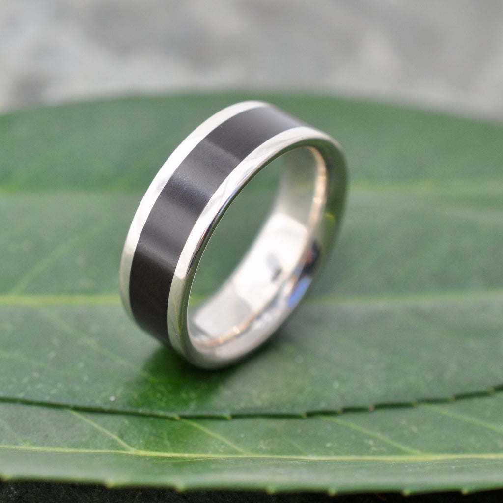 Comfort Fit Lados Coyol Seed Wood Ring with 14k White Gold on a leaf