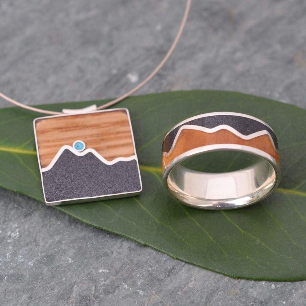 Mountain range necklace with turquoise accent and volcanic titanium sand