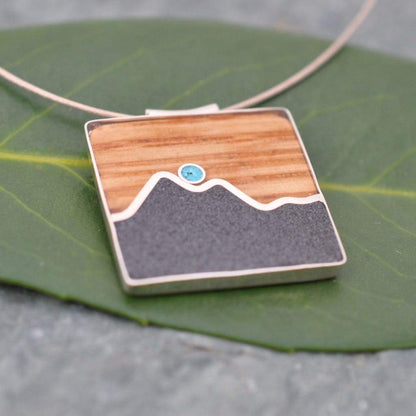 Wood mountain necklace with turquoise stone and bourbon barrel inlay