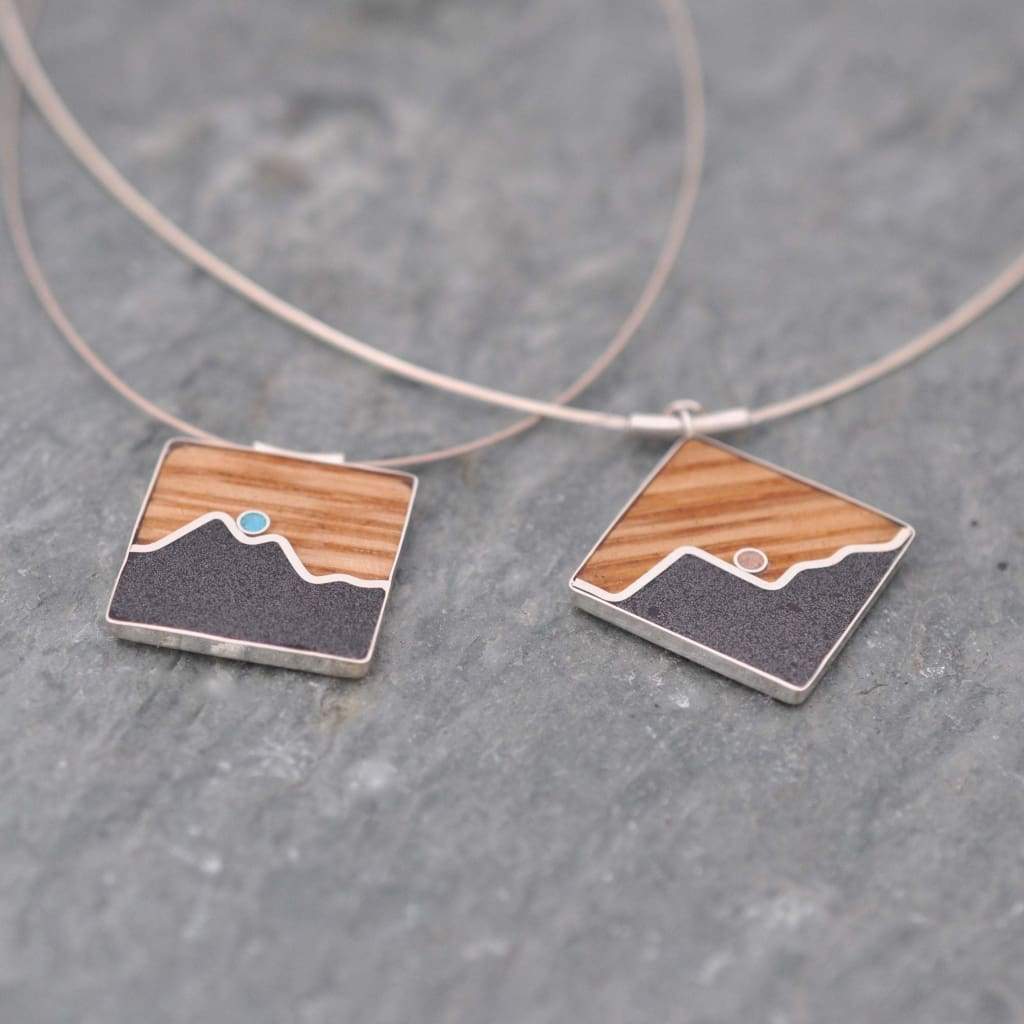 Wood mountain necklace with turquoise and titanium sand inlay