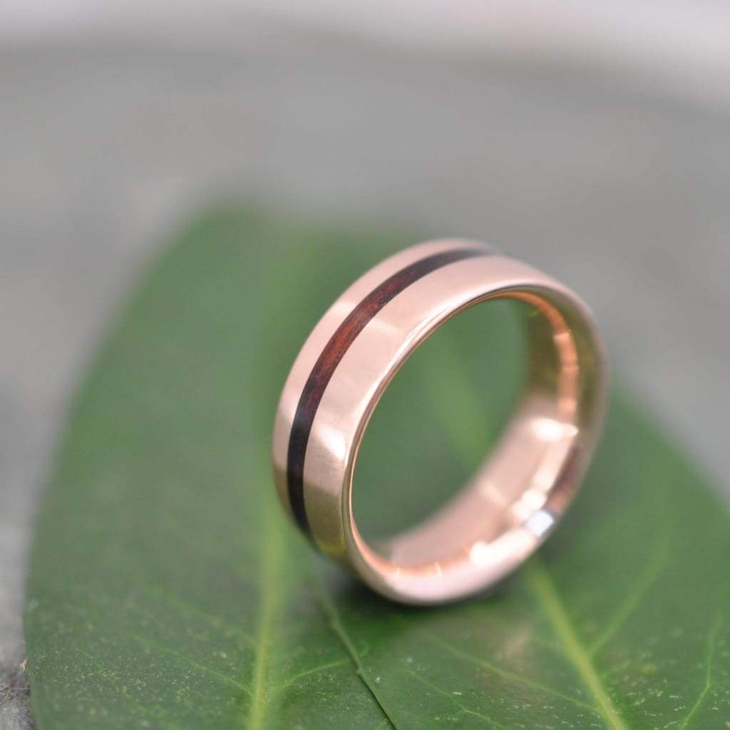 Rose gold koa wood ring showing natural koa grain and comfort fit interior