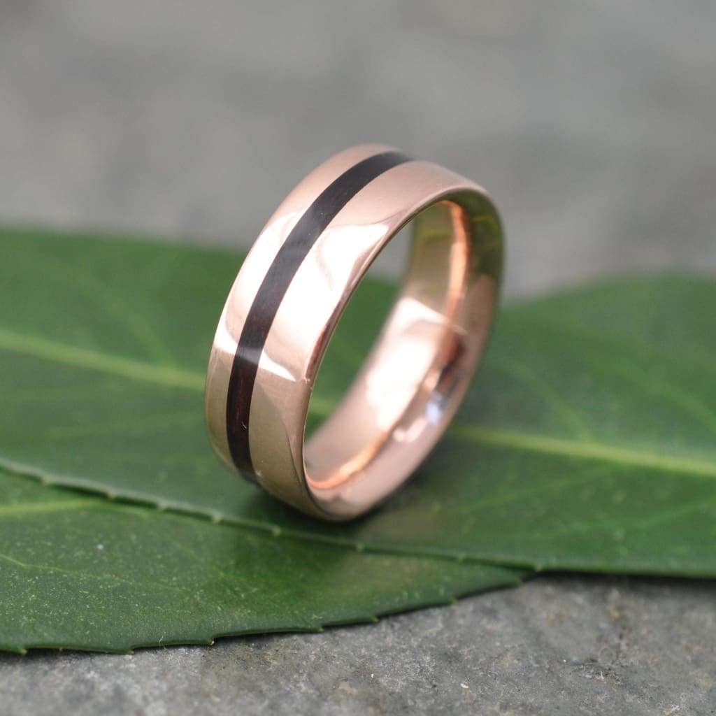Natural koa wood wedding band with rose gold edges and comfort fit
