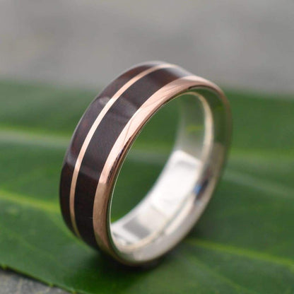 Un Lado Asi nacascolo ring with rose gold exterior and sterling silver inner band
