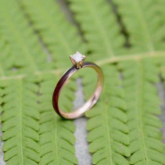 Rose gold diamond wood engagement ring with koa wood and princess cut diamond side profile