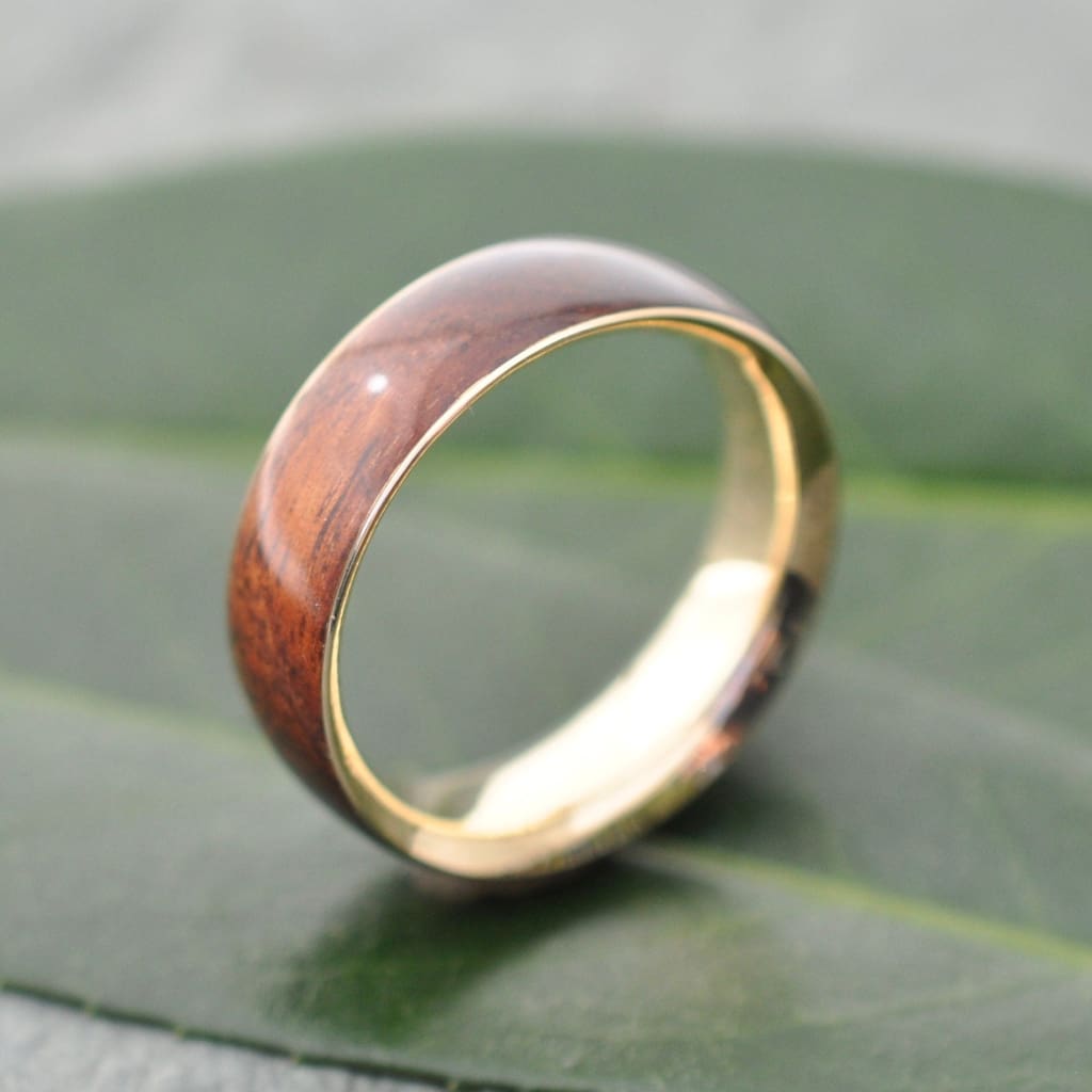Sustainable wedding ring with recycled yellow gold and koa wood