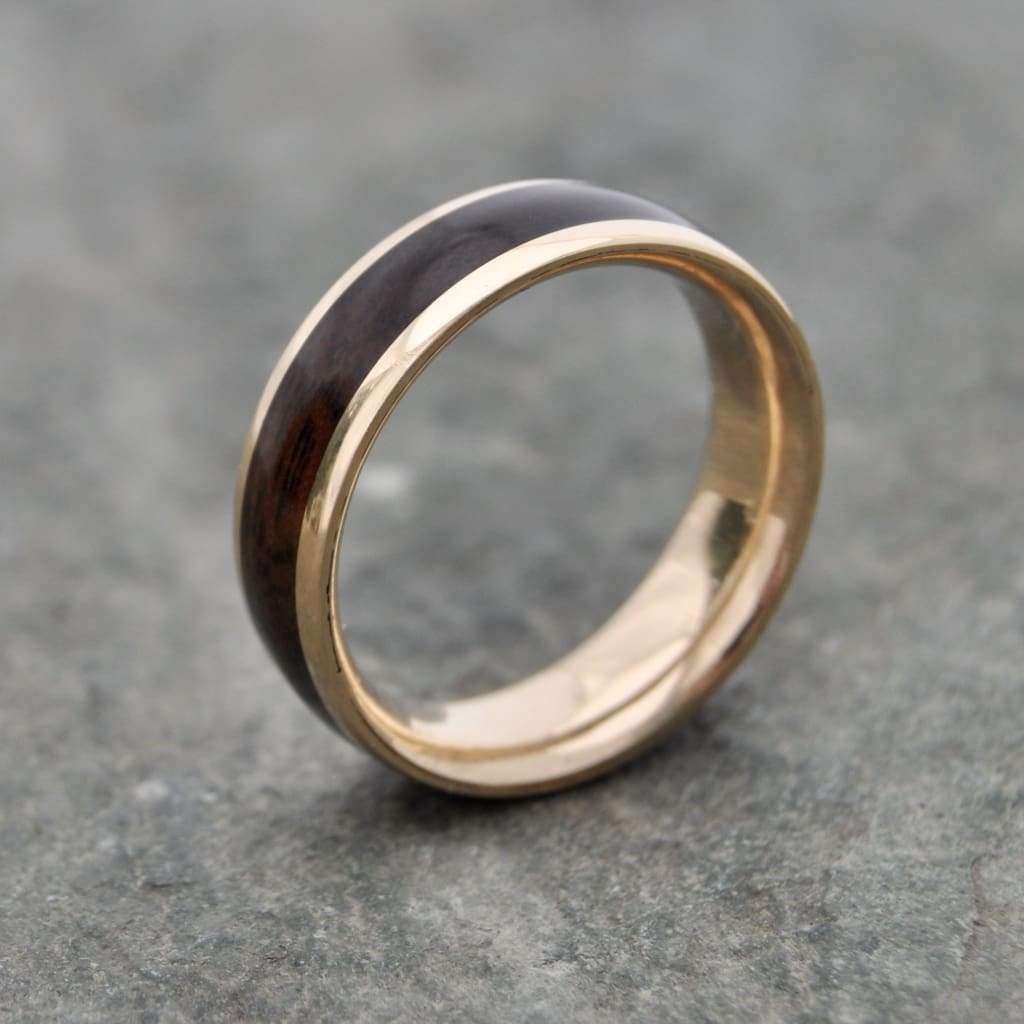 Sustainable walnut wood men’s ring with 14k recycled yellow gold lining.