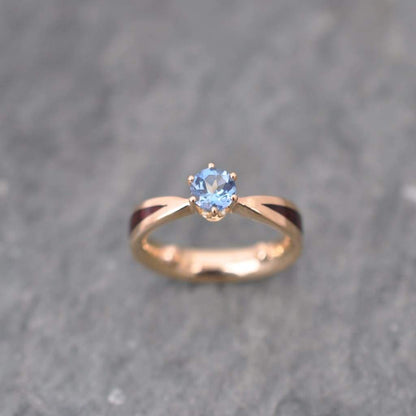 Sustainable wooden engagement ring with aquamarine solitaire and recycled 14k yellow gold, ethically sourced materials, handcrafted to order in Louisville Kentucky