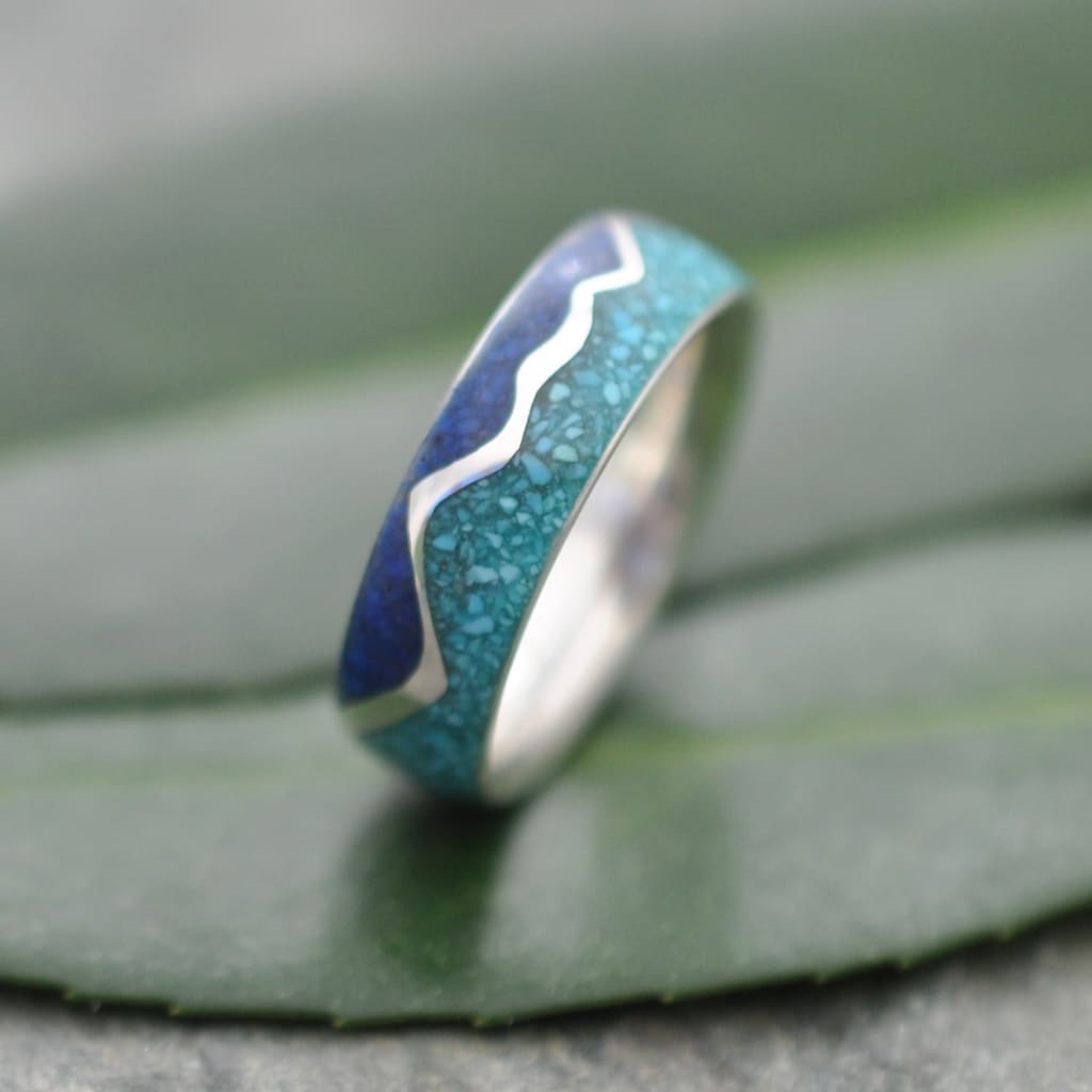 Turquoise and lapis lazuli ring pair showing wavy mountain pattern