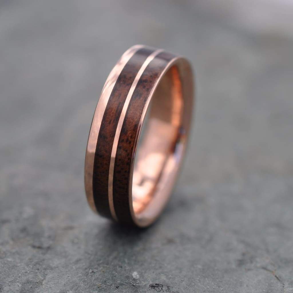 Un Lado Asi walnut wood ring with recycled rose gold interior and exterior
