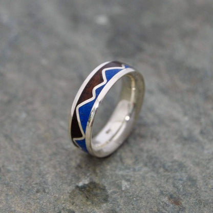 Lapis lazuli mountain ring showing blue stone inlay and walnut grain