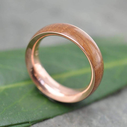 Siempre bourbon barrel ring with rose gold showing aged white oak grain